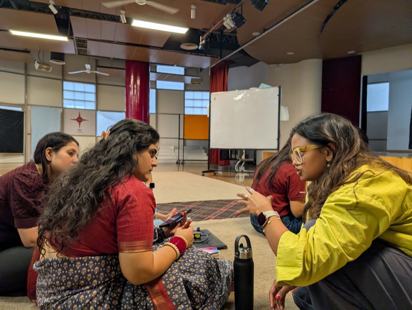 Teachers working together in a small group during a Tilli training