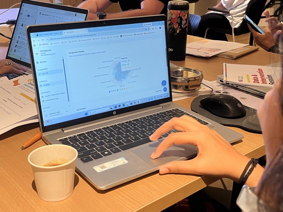 Teacher exploring the Tilli assessment dashboard